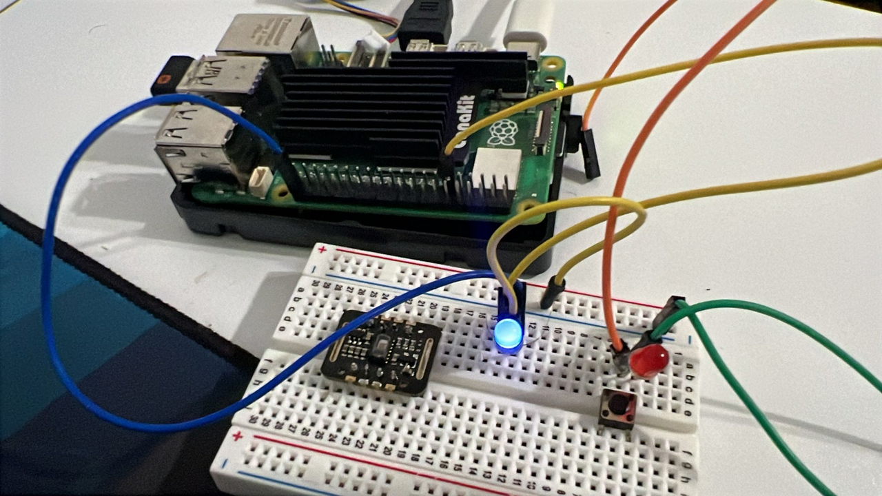 Image Alt Text:Raspberry Pi 5 connected to a breadboard with LEDs, push button, and sensor module alt-text