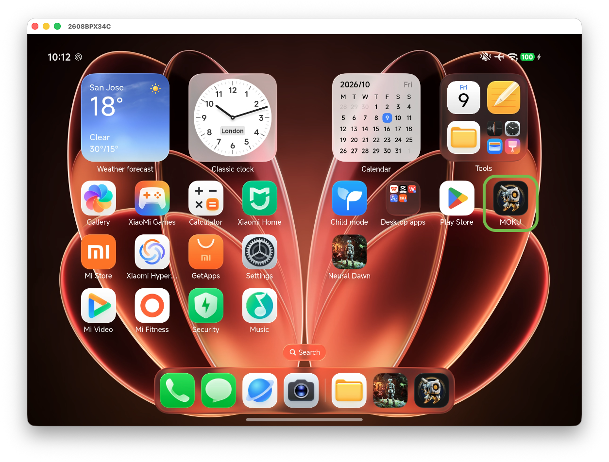 Image Alt Text:Xiaomi 18 Fold home screen mirrored in scrcpy, with the example MOKU app icon outlined in green on the right, confirming the app is installed before launch